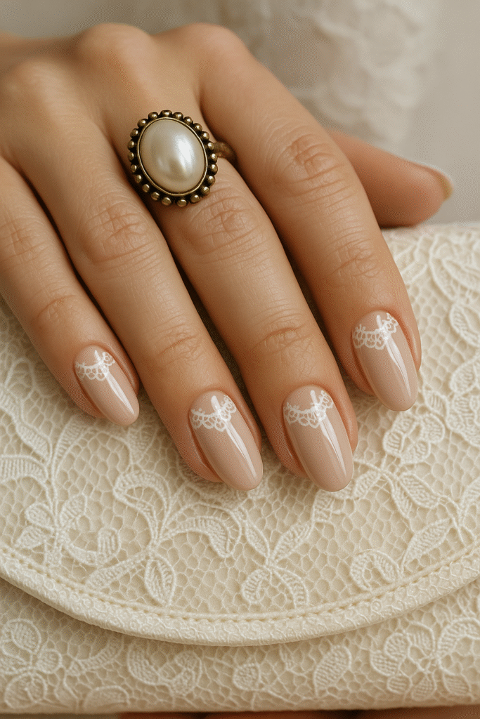 Glossy Beige Nails with Lace-Inspired Decals